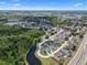 Aerial view showcasing a residential area with multiple lakes, green spaces, and a mix of housing options at 144 Bridgeton St, Davenport, FL 33896
