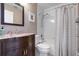 Bathroom features a shower-tub combo with a stylish vanity and framed mirror at 144 Bridgeton St, Davenport, FL 33896
