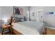 Comfortable primary bedroom featuring gray walls, natural light, and hardwood floors at 144 Bridgeton St, Davenport, FL 33896