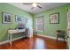Office space in bedroom with natural lighting, desk, and hardwood floors at 144 Bridgeton St, Davenport, FL 33896