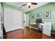 Bedroom with hardwood floors, ceiling fan, and a closet at 144 Bridgeton St, Davenport, FL 33896
