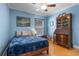 Classic bedroom with hardwood floors, a ceiling fan, and lots of natural light at 144 Bridgeton St, Davenport, FL 33896