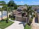 Lovely single-story home featuring a two-car garage, and mature palms at 144 Bridgeton St, Davenport, FL 33896