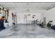 Spacious two car garage with painted walls and ceiling provides ample storage and utility at 144 Bridgeton St, Davenport, FL 33896