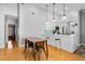 Bright kitchen features a breakfast bar with pendant lighting and stainless steel appliances at 144 Bridgeton St, Davenport, FL 33896