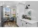Bright kitchen nook with seating, white cabinets, and modern lighting provides a cozy atmosphere at 144 Bridgeton St, Davenport, FL 33896
