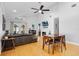 Open living room showcases a fireplace, high ceilings, and a ceiling fan at 144 Bridgeton St, Davenport, FL 33896