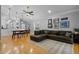 Open-concept living room flowing into the dining area, perfect for entertaining and Gathering gatherings at 144 Bridgeton St, Davenport, FL 33896