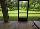 Spacious backyard view from the lanai of the lush green lawn at 14845 Speer Lake Dr, Winter Garden, FL 34787
