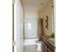 Bathroom featuring tub with shower and a granite topped vanity at 14845 Speer Lake Dr, Winter Garden, FL 34787