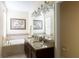 Bright bathroom features a double vanity with granite countertop and a soaking tub at 14845 Speer Lake Dr, Winter Garden, FL 34787