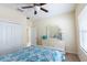 Bedroom offering a dresser and a large window with natural light at 14845 Speer Lake Dr, Winter Garden, FL 34787