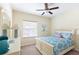 Bedroom with a queen bed, dresser and a window with lots of natural light at 14845 Speer Lake Dr, Winter Garden, FL 34787