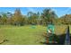 Community dog park with grassy area, agility equipment, and seating for pet owners at 14845 Speer Lake Dr, Winter Garden, FL 34787