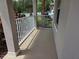 Covered front porch with tiled floor and white railing provides curb appeal at 14845 Speer Lake Dr, Winter Garden, FL 34787