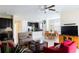 Open-concept living area with dark kitchen cabinets, tile floors, and natural light at 14845 Speer Lake Dr, Winter Garden, FL 34787