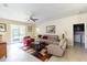 Comfortable living room featuring neutral colors, a ceiling fan, and a colorful area rug at 14845 Speer Lake Dr, Winter Garden, FL 34787