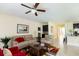 Comfortable living room with tan couches and views of the kitchen at 14845 Speer Lake Dr, Winter Garden, FL 34787