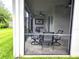 Covered screened patio with a beautiful lawn view is perfect for entertaining at 14845 Speer Lake Dr, Winter Garden, FL 34787