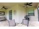 Screened in lanai has tile flooring, seating and is ready for grilling at 14845 Speer Lake Dr, Winter Garden, FL 34787