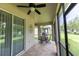 Enjoy the view from the covered lanai with access to a large green lawn at 14845 Speer Lake Dr, Winter Garden, FL 34787
