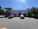 Commercial building with various businesses and ample parking at 14845 Speer Lake Dr, Winter Garden, FL 34787
