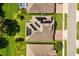 An overhead view of a neighborhood displaying solar panels, beautiful landscaping, and well-maintained roads at 1507 Alligator St, St Cloud, FL 34771