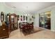 Light-filled dining room with a sliding glass door, tile flooring, and dark wooden furniture at 1507 Alligator St, St Cloud, FL 34771