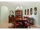 Elegant dining room with wooden furniture, decorative wall art, and light-green painted walls at 1507 Alligator St, St Cloud, FL 34771