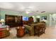 Inviting living room with tile floors, a ceiling fan, and classic decor and furnishings at 1507 Alligator St, St Cloud, FL 34771