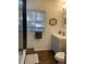 Bathroom features a stylish vanity, modern fixtures, and wood-look tile flooring at 162 Orange Pl, Maitland, FL 32751