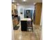 Efficient kitchen layout with light wood cabinets, subway tile backsplash, and a functional center island at 162 Orange Pl, Maitland, FL 32751