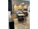 Well-equipped kitchen features ample wooden cabinetry, stainless steel appliances, and a central island with bar seating at 162 Orange Pl, Maitland, FL 32751
