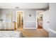 Bedroom features a neutral color scheme with easy access to the adjacent ensuite bathroom and hallway at 16610 County Line Rd, Umatilla, FL 32784