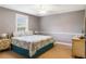 Cozy bedroom with carpet, a ceiling fan, ample light, and neutral-toned walls create a serene atmosphere at 16610 County Line Rd, Umatilla, FL 32784