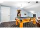 Spacious game room with a light wood pool table, billiard accessories and unique carpet design at 16610 County Line Rd, Umatilla, FL 32784