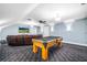 Spacious game room with a pool table, a leather couch, and recessed lighting at 16610 County Line Rd, Umatilla, FL 32784