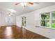 Spacious living room with wood floors, recessed lighting, and windows overlooking the yard at 16610 County Line Rd, Umatilla, FL 32784