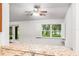 Bright living room with great view and lots of light, granite countertops and a ceiling fan at 16610 County Line Rd, Umatilla, FL 32784