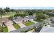 A collection of well-maintained homes line a suburban street with manicured lawns and mature landscaping at 16950 Se 80Th Bellavista Cir, The Villages, FL 32162