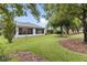 The property boasts a well-manicured lawn and mature trees, perfect for outdoor enjoyment at 16950 Se 80Th Bellavista Cir, The Villages, FL 32162