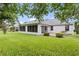 The house has a screened patio and a lush lawn, perfect for enjoying the outdoors at 16950 Se 80Th Bellavista Cir, The Villages, FL 32162