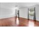 Large bedroom with hardwood floors, ceiling fan, and neutral paint tones at 16950 Se 80Th Bellavista Cir, The Villages, FL 32162
