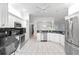 Modern kitchen with stainless steel appliances, granite countertops, and ample cabinet space at 16950 Se 80Th Bellavista Cir, The Villages, FL 32162