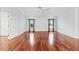 Bright living room with hardwood floors and crown molding, offering ample space at 16950 Se 80Th Bellavista Cir, The Villages, FL 32162