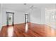 Spacious living area with hardwood floors and crown molding, bathed in natural light at 16950 Se 80Th Bellavista Cir, The Villages, FL 32162