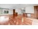 Spacious living room with hardwood floors, built-in cabinets, and large windows at 16950 Se 80Th Bellavista Cir, The Villages, FL 32162