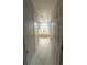 Bright bathroom features a soaking tub under a window with tiled floors at 1784 Providence Blvd, Deltona, FL 32725