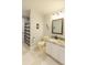 Bathroom with granite vanity and decorative mirror, as well as bathtub at 1784 Providence Blvd, Deltona, FL 32725
