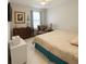 Cozy bedroom featuring a ceiling fan, patterned bedding, and ample natural light from a window at 1784 Providence Blvd, Deltona, FL 32725
